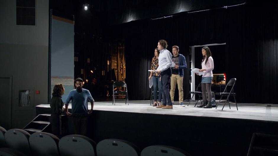 Jimmy interrupts Peyton and Ravi's conversation after waiting on stage with his improv troop.