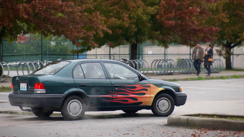 Lee Mooney speeds off through the parking lot in his vandalized car.