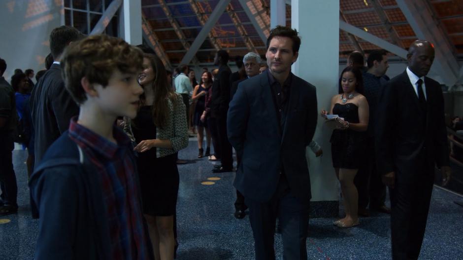 Maxwell Lord approaches Carter after he was turned away by security.