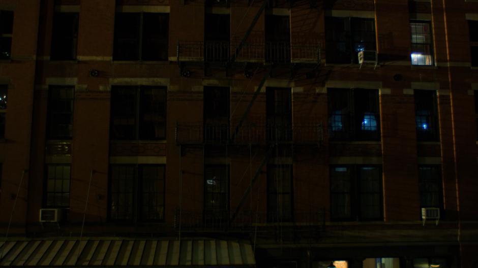 Jessica watches from the darkened hotel room late into the night.