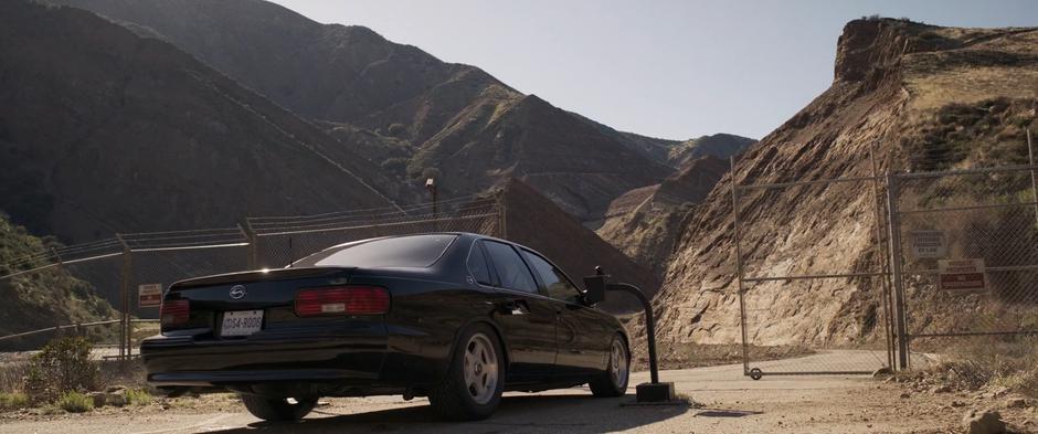 The gate opens up and Fury drives the car through to the base.