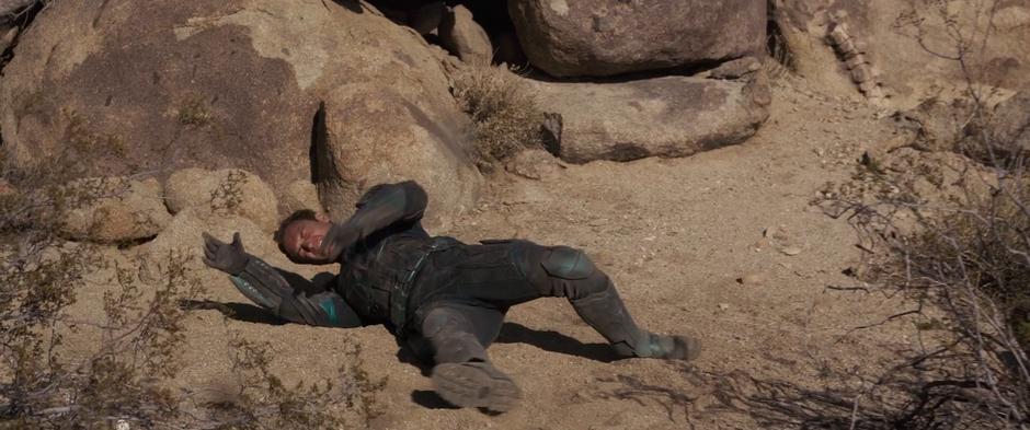 Yon-Rogg struggles to sit up after being thrown into some rocks by Carol's photon blast.