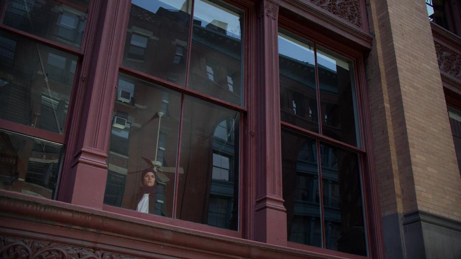 Trish looks at the hotel across the street from Andrew Brandt's apartment.