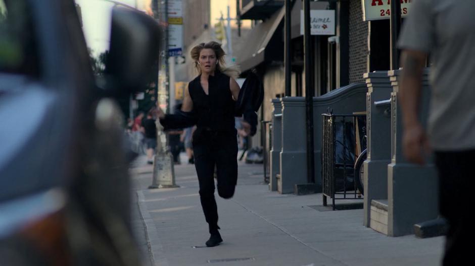 Trish races down the sidewalk.