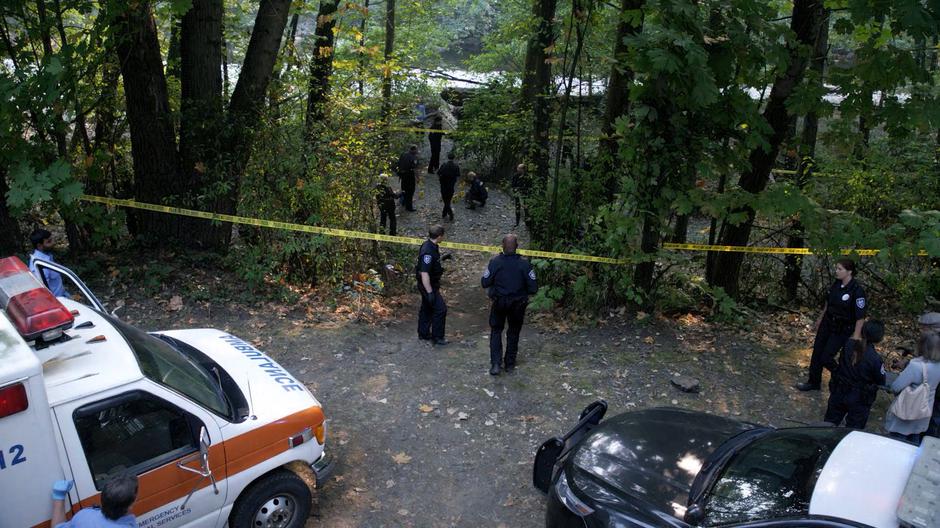 The police search the woods for clues on the disappearance.