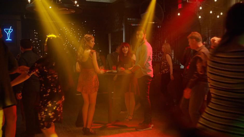 Liv looks excited and Ravi looks worried as the tables are cleared away to make a dance floor.