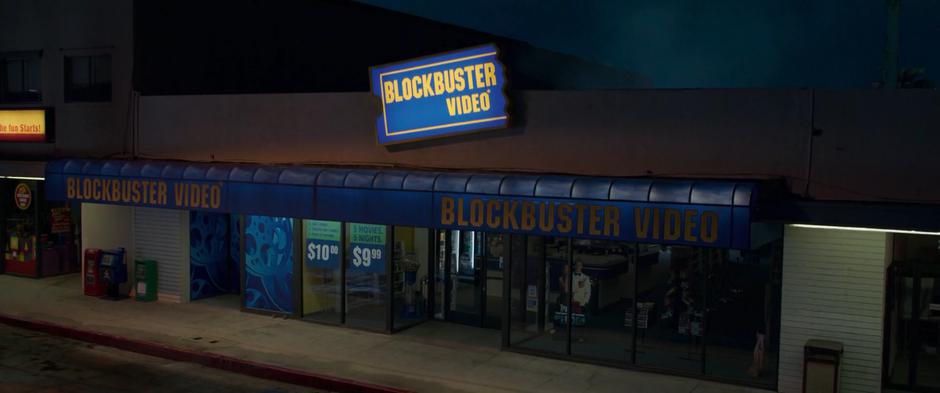 Dust rises from the roof of the Blockbuster after Vers crashed through it.