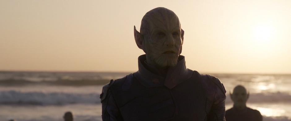 Talos emerges from the water with several other Skrull.