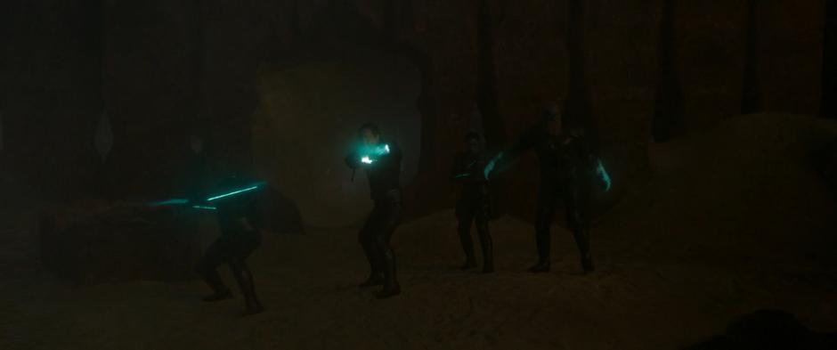 Yon-Rogg and his squad stand wit their weapons ready and glowing.