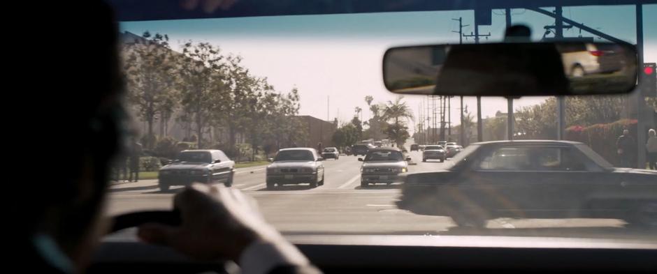 Fury drives through a red light while racing after the train.