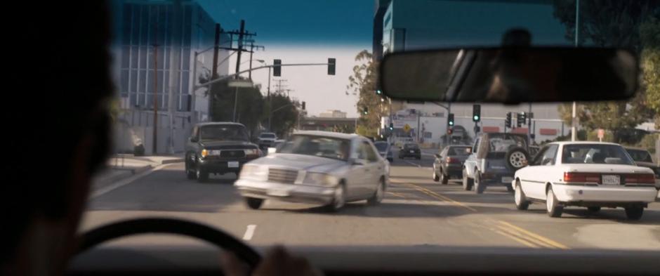 Several cars swerve to avoid a collision with Fury's car as he drives down the wrong side of the road.