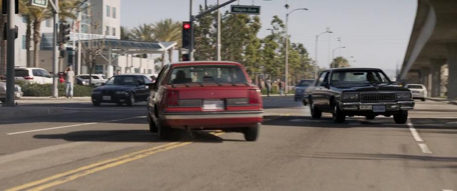 A car swerves out of the way as Fury drives through the oncoming traffic lane.