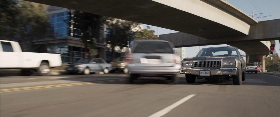 Fury hits the back of a car that couldn't swerve out of the way fast enough while he drives downt he wrong side of the street.