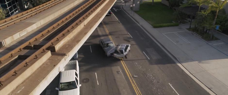 Two cars impact after being knocked aside by Fury.