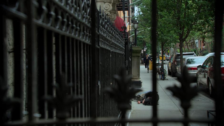 Trish runs down the street towards Jessica who has collapsed.