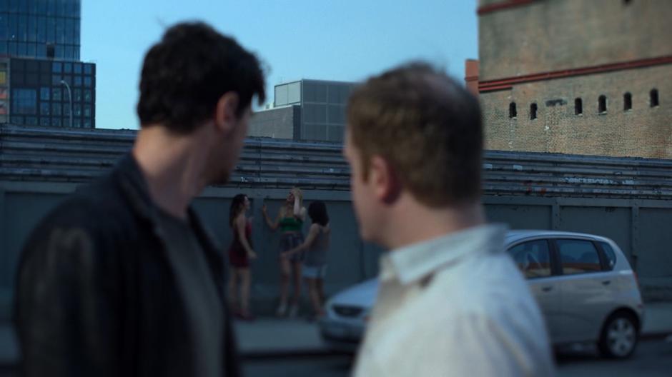 Erik and Gregory Sallinger look over at Berry as they talk.