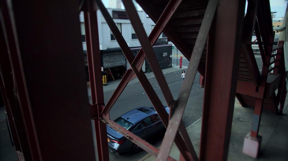 Jessica walks over to Trish's parked car.