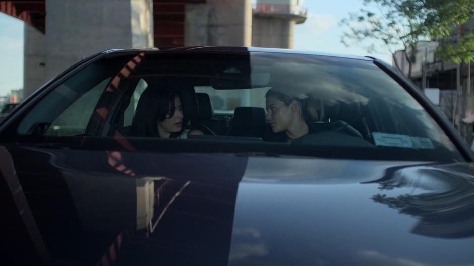 Jessica tells Trish to cool down and let the police handle matters while they are sitting in Trish's car.