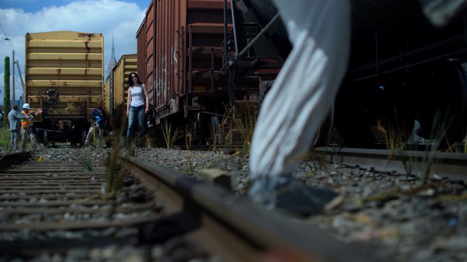 Jessica watches as the police remove body parts from the tanker car.