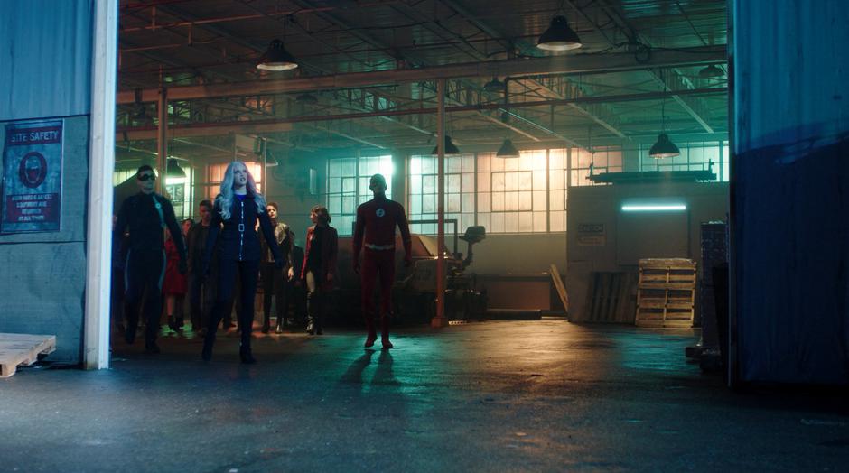 Ralph, Killer Frost, and Barry walk over to the door as the helicopter approaches from above.