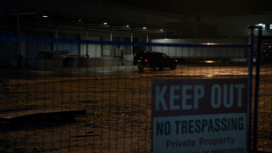 The kidnapper drives off in his SUV past the fence.