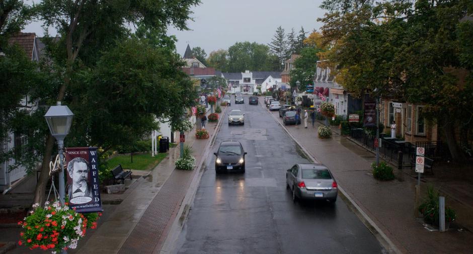 Stephanie drives down Main Street towards her kid's school.