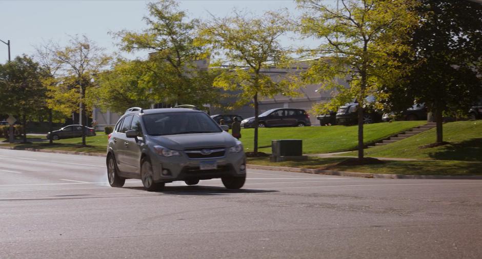 Stephanie drives her car into the intersection after missing the red light.