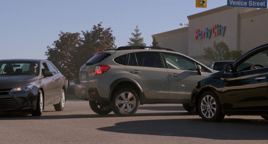 Stephanie's car comes to a stop among several others after closely avoiding an accident.