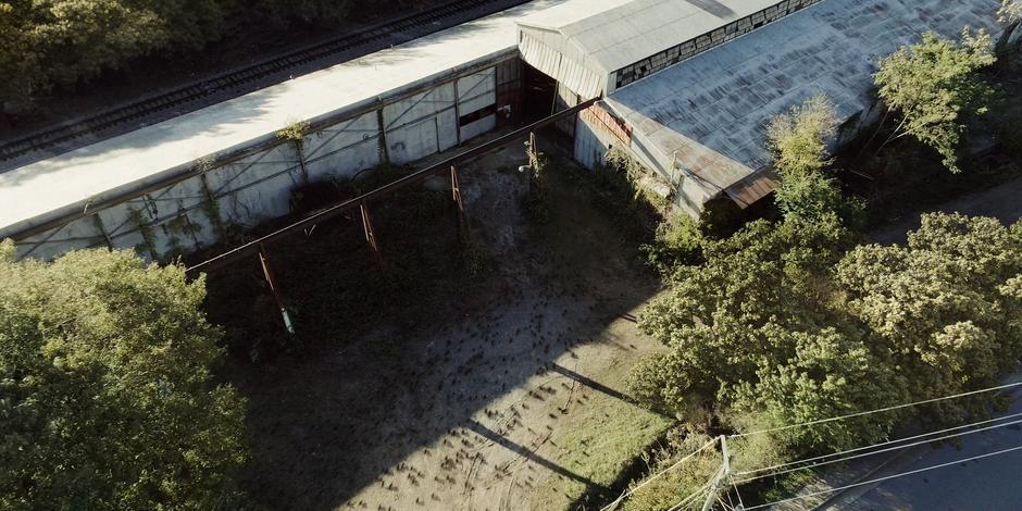 Hundreds of rats swarm into the abandoned factory.