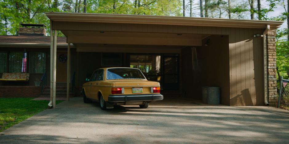 Dustin's mom pulls the car into the parking spot.