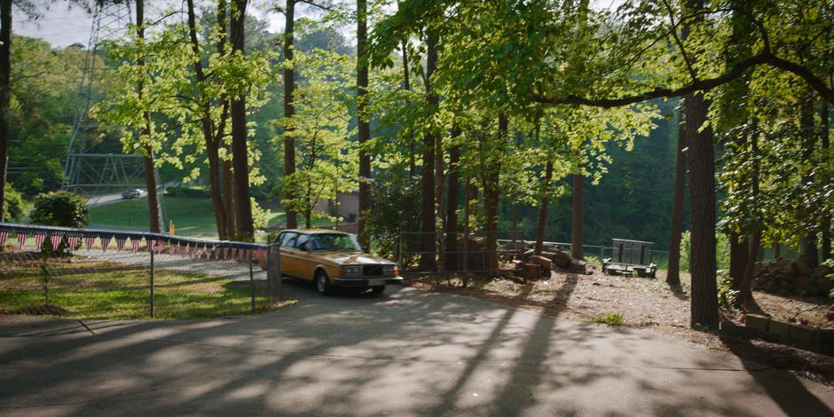 Dustin and his mom drive up the driveway to their home.