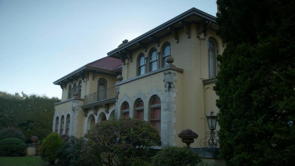 Establishing shot of the back of the mansion.