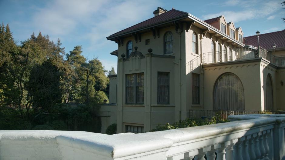 Establishing shot of the side of the mansion.