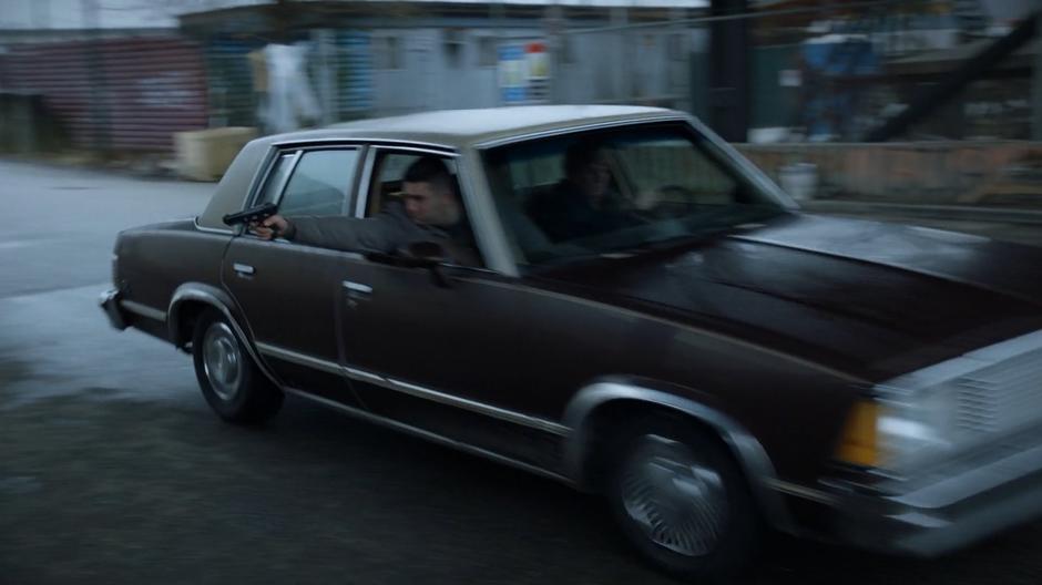 A Dead Ender fires at Major from his car as it is driven past.