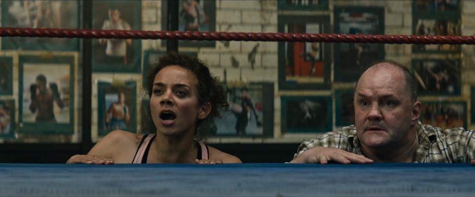 Sophie yells up at Lara while watching from the edge of the ring with Terry.