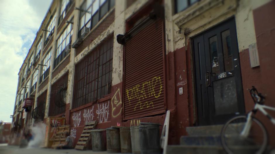 Establishing shot of the rundown building containing Trish's new apartment.