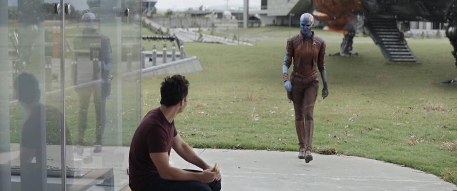 Nebula glances as Scott as she walks past him from the Milano.