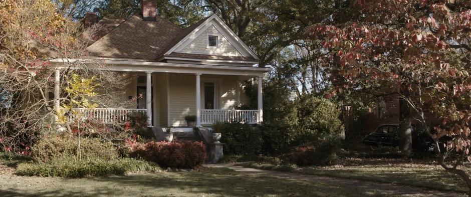 Establishing shot of Peggy's house sitting back from the street.