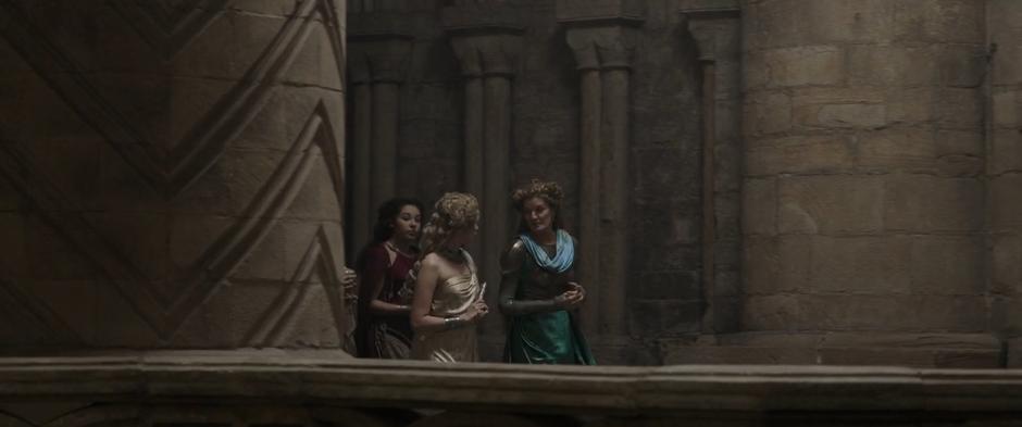 Frigga walks with some other Asgardian women.