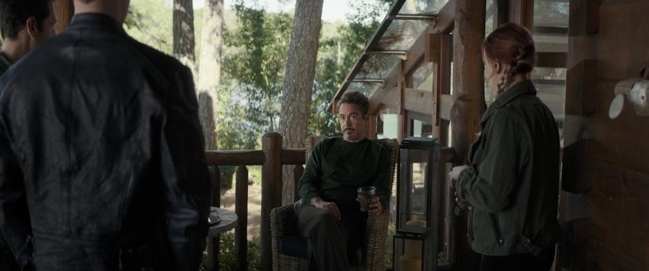 Tony sits on the back deck listening to Scott, Steve, and Natasha's plan.