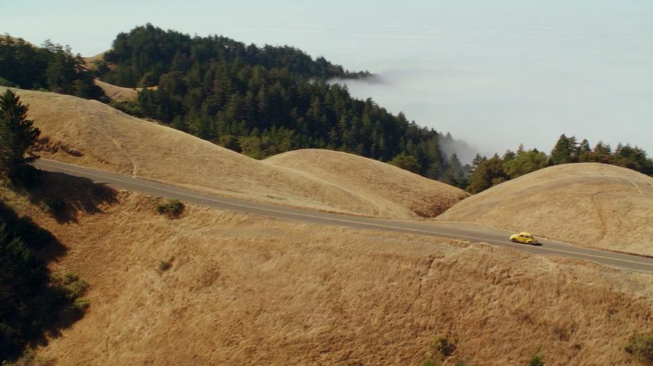 Bumblebee drives back down the road along the top of the mountain.