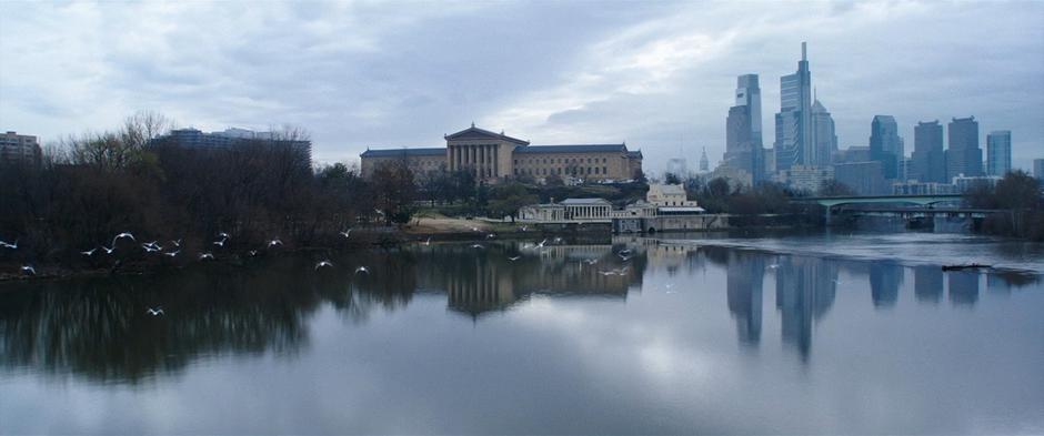 Establishing shot of the museum viewed from over the water.