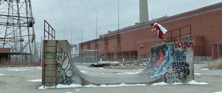 Billy runs down the side of a graffiti-covered half-pipe in an attempt to fly.