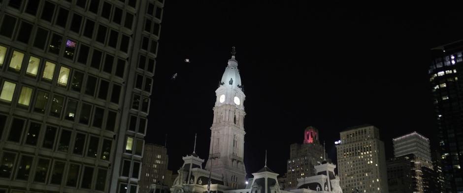 Sivana chases Billy through the air towards City Hall.