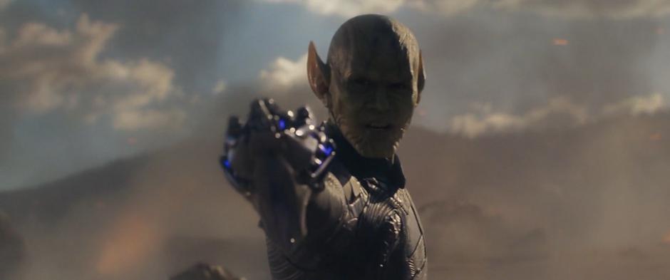 A Skrull points his gun at the woman during Vers's dream.