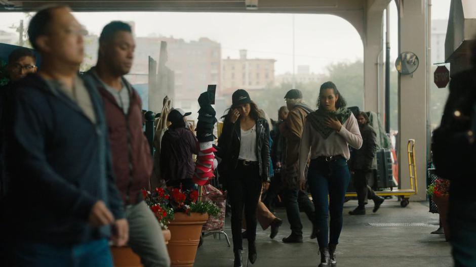 Abigael and Macy try to blend in with the crowd on the station platform.