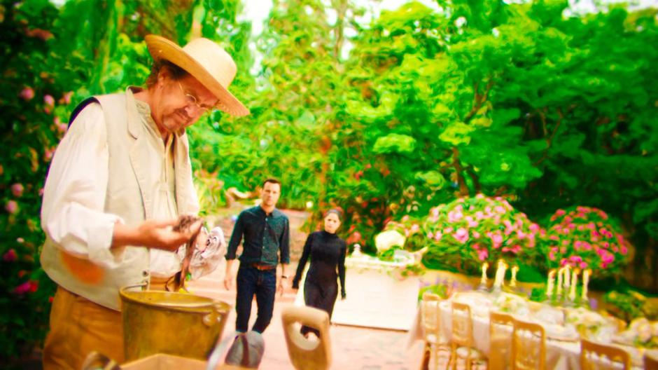 Harry and Mel approach the Sentinel as he is messing with a bucket of worms.