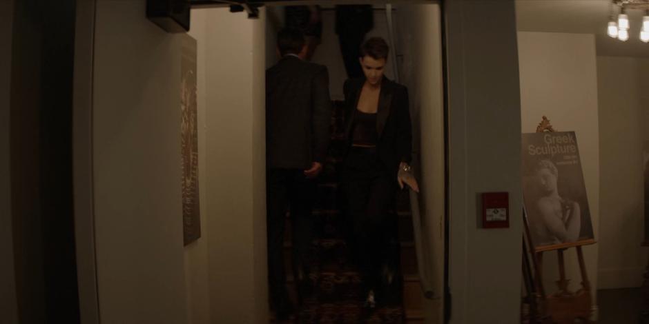 Kate walks down into the basement with her bag of supplies.