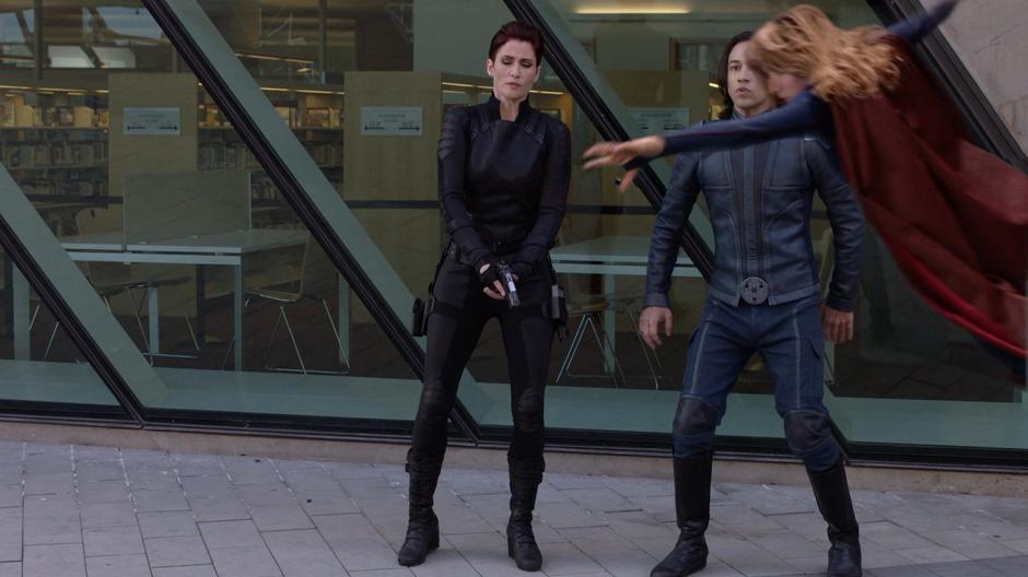 Kara leaps in front of Alex and Brainy to stop a bullet fired by an incepted agent.