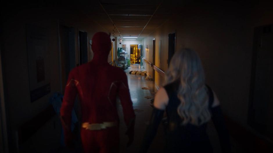 Barry and Frost speed into the hospital, find the hallway trashed, and see a body in the distance.